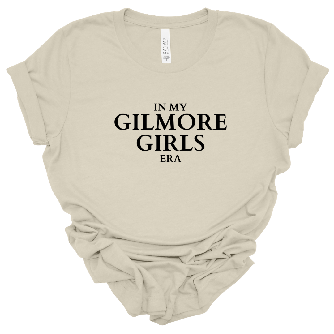 "In My Gilmore Girls Era" Graphic T-Shirt Flat Lay In Sand – Gilmore Girls Inspired Fan Shirt