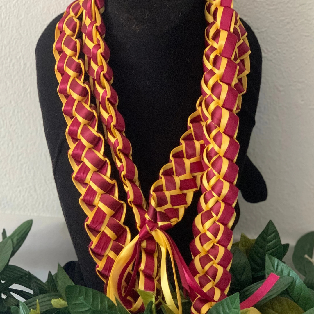 Custom Graduation Money Lei with rolled bills, vibrant ribbons, and graduation-themed decorations. Additional charge of $25 for all custom money lei. order now! Don't wait.