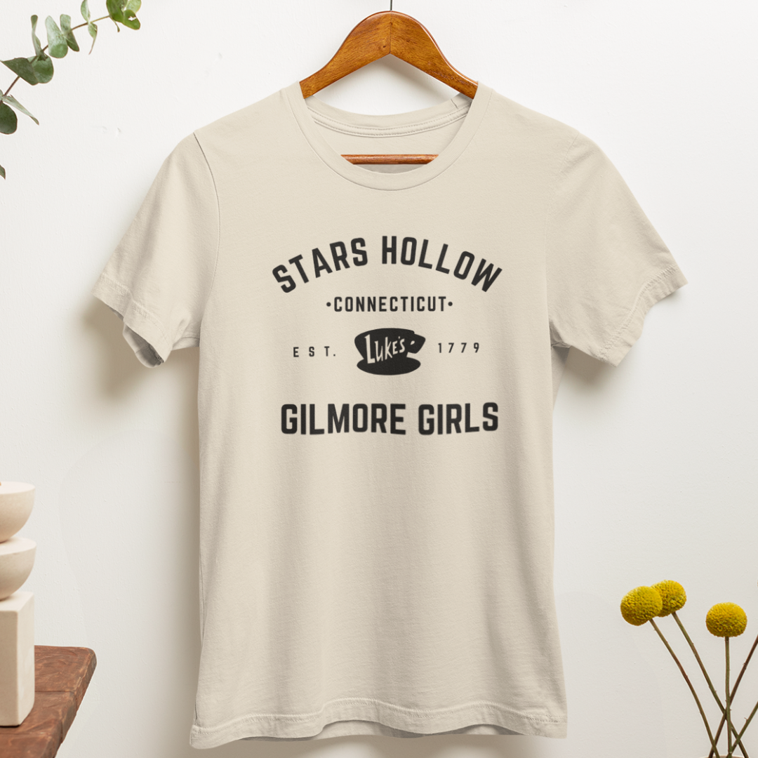 "Stars Hollow" t-shirt, a pop culture shirt hanging on a hanger.