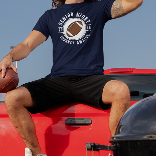 High school quarterback with his navy blue Class of 2026 football senior night shirt with Journey Awaits logo and football graphic