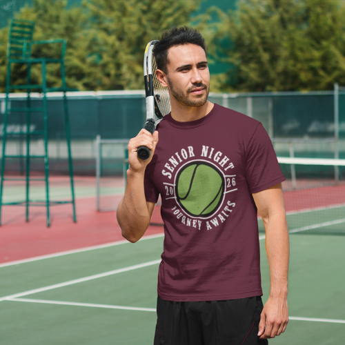 Senior student holding a tennis racket on a tennis court wearing his 2026 senior night t-shirt with a graphic design.