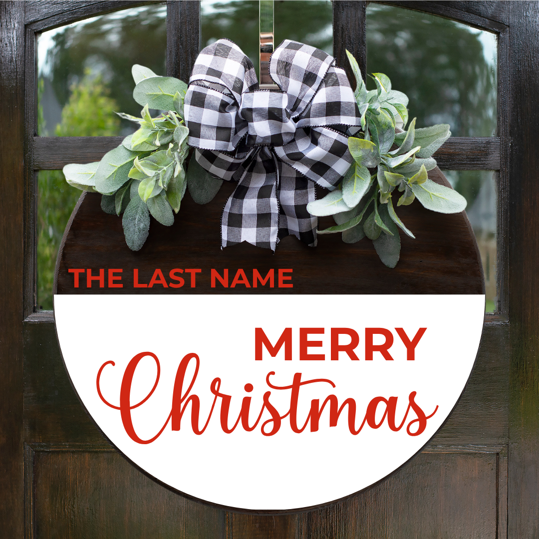 Personalized Merry Christmas round door hanger in red script with family last name, buffalo plaid bow — custom holiday sign by Simply Aloha On The Go