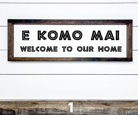 Handcrafted tropical wooden sign with "E Komo Mai" and "Welcome" painted in a rustic Hawaiian island style. Perfect housewarming gift