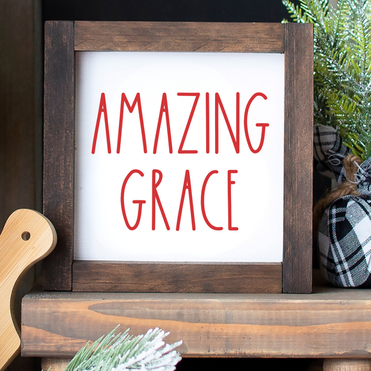Handcrafted 6x6 rustic wood framed Amazing Grace sign styled on a tiered tray next to other faith-based holiday signs.