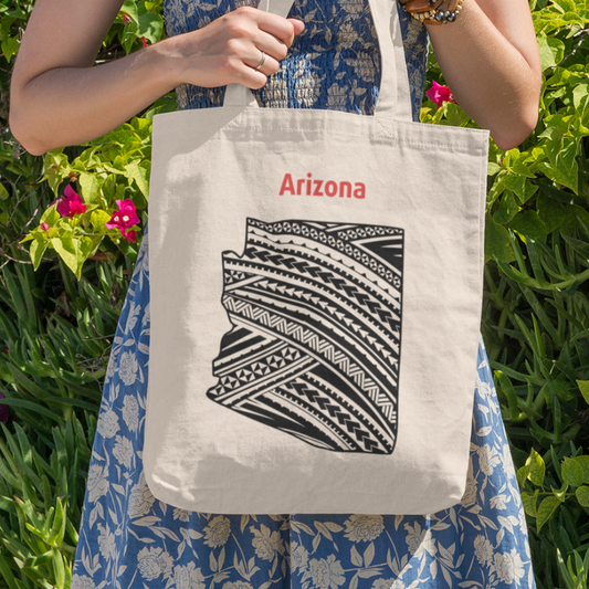 Polynesian state map tote bag featuring a double-sided Arizona outline with black Polynesian-inspired patterns and red Arizona lettering on natural canvas.
