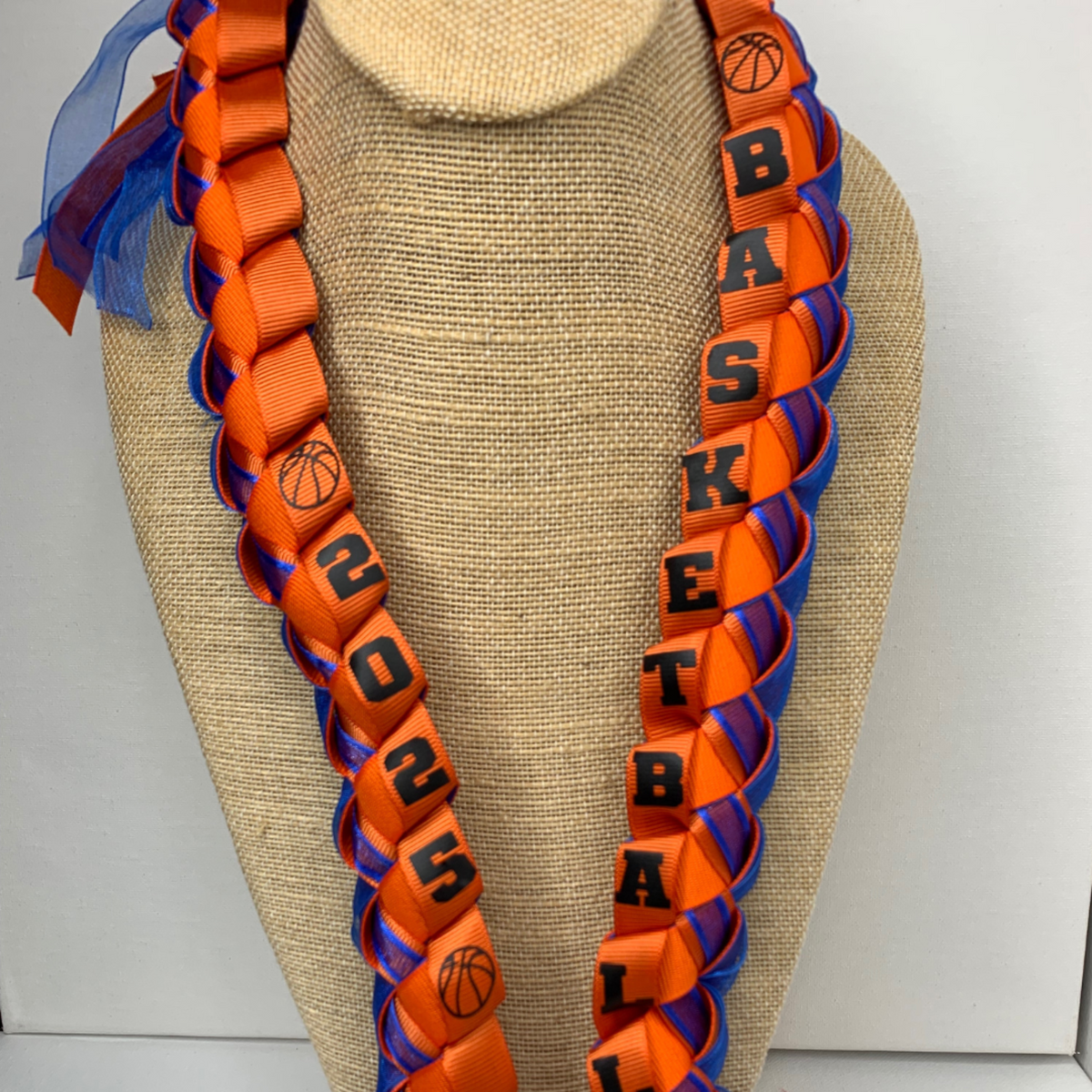 Close up Personalized Basketball Ribbon Lei in school or team colors for Senior Night, graduation, basketball banquets, and basketball player gifts.