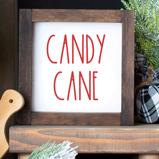 Handcrafted 6x6 rustic wood framed Candy Cane sign styled on a Christmas tiered tray on a white background.