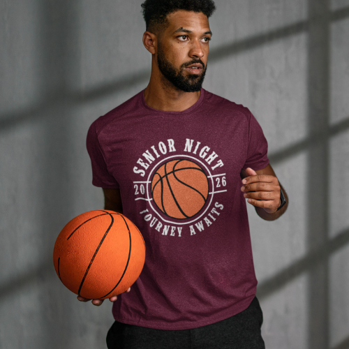 Student male holding a basketball wearing his 2026 maroon senior night t-shirt with a graphic design. available in other colors.