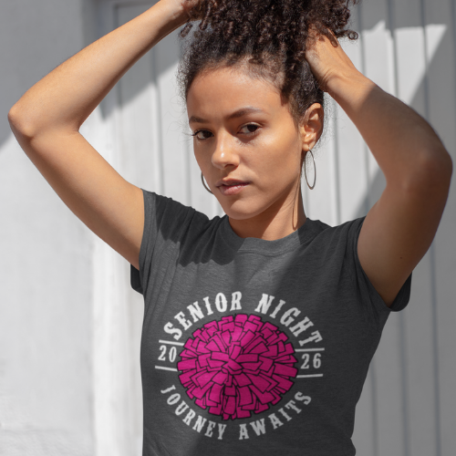 Woman wearing a grey t-shirt with Senior Night 2026 Journey Awaits design against a light background