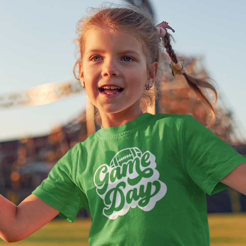 Personalized Kids Girls Green Double-Sided T-Shirt featuring a football graphic and game day text on the front and a player number on the back, from Simply Aloha On The Go.