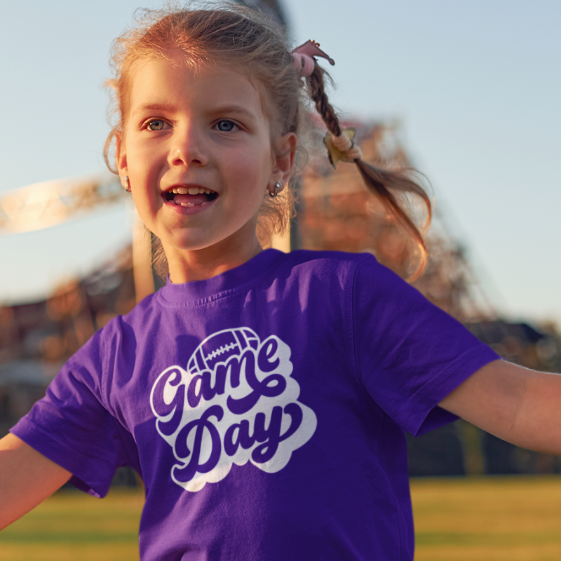 Personalized Kids Girls Purple Double-Sided T-Shirt featuring a football graphic and game day text on the front and a player number on the back, from Simply Aloha On The Go.
