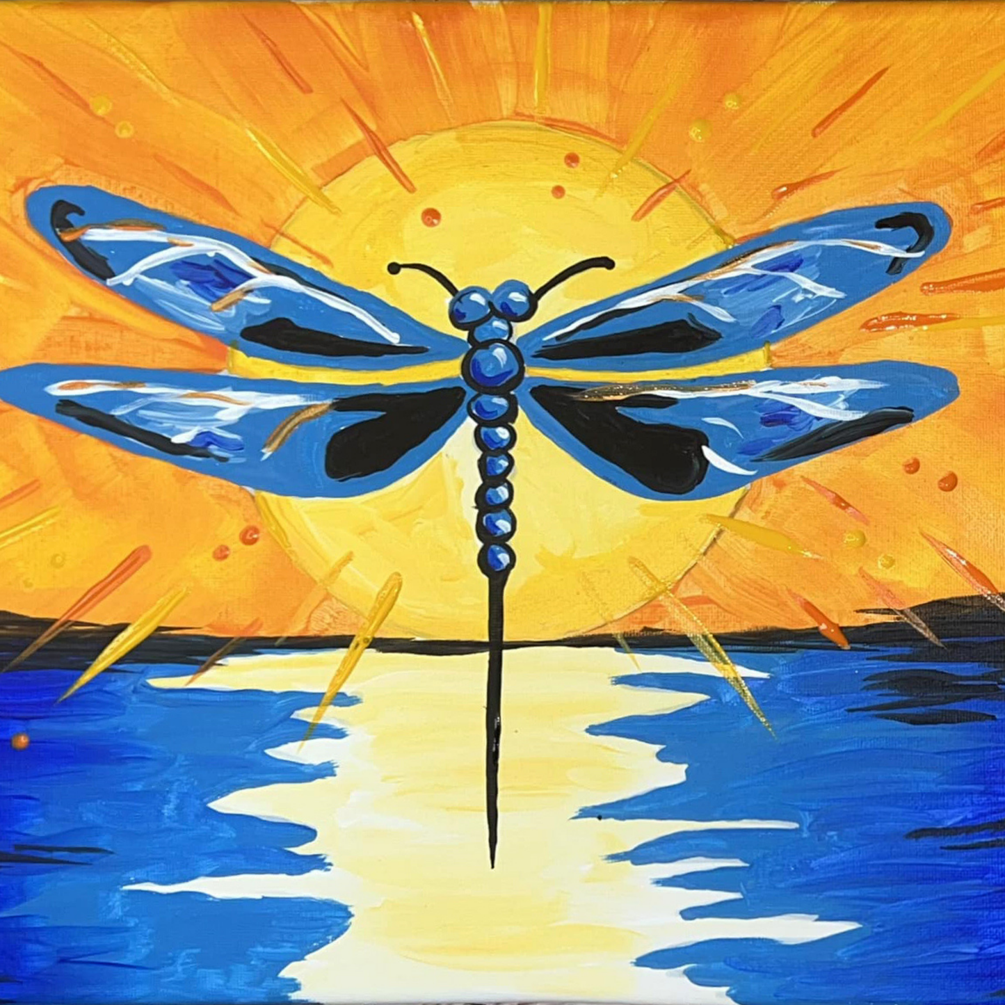 A blue dragonfly silhouette centered over a bright yellow sun reflecting on blue water.