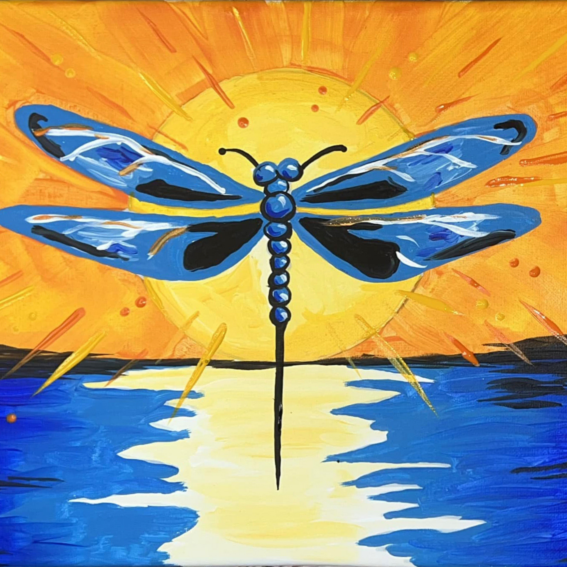 A blue dragonfly silhouette centered over a bright yellow sun reflecting on blue water.