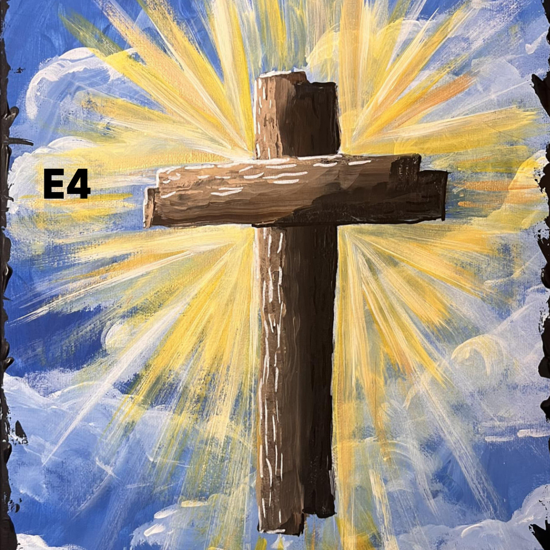Painted cross with bright yellow rays against a blue sky, included painting supplies