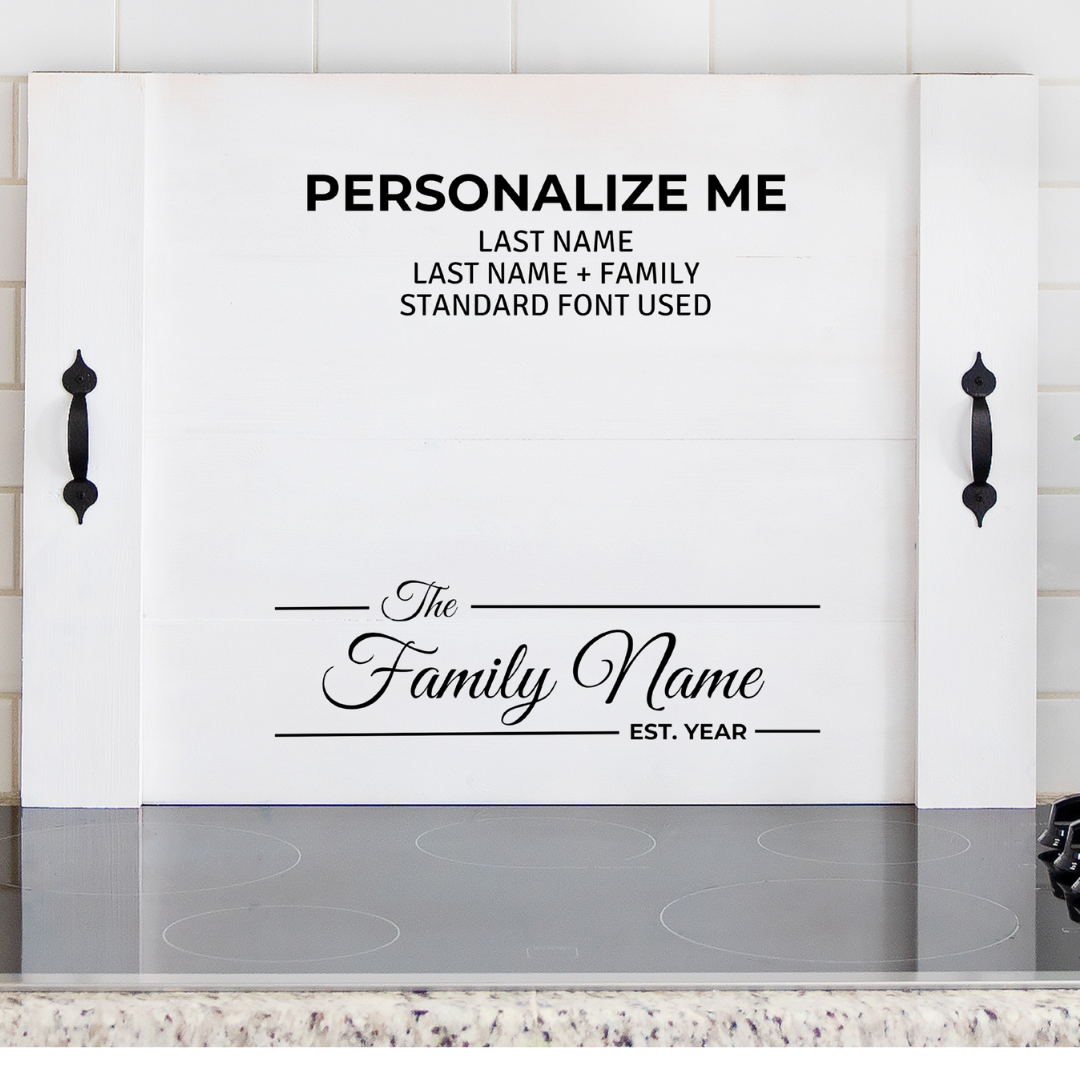 Personalized farmhouse stove top cover with custom last name and established date on a wooden noodle board.