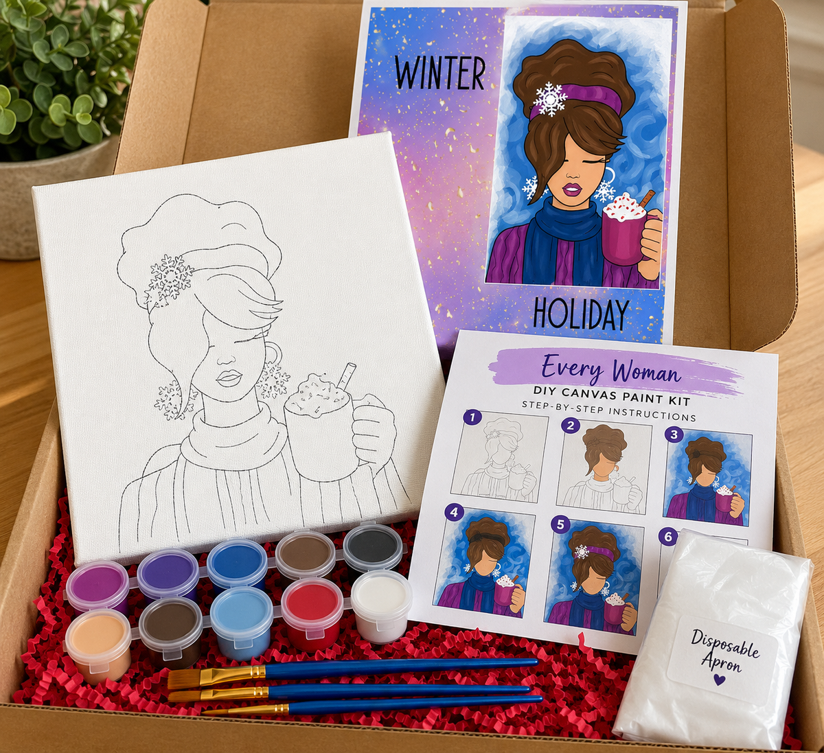 Winter Cocoa DIY canvas paint kit featuring a woman holding hot cocoa, pre-outlined canvas, acrylic paints, paintbrushes, disposable apron and instructions.