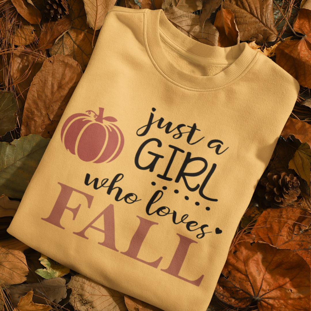 Just a girl who loves fall text t-shirt with a  pumpkin graphic. Available in fall colors and sizes 