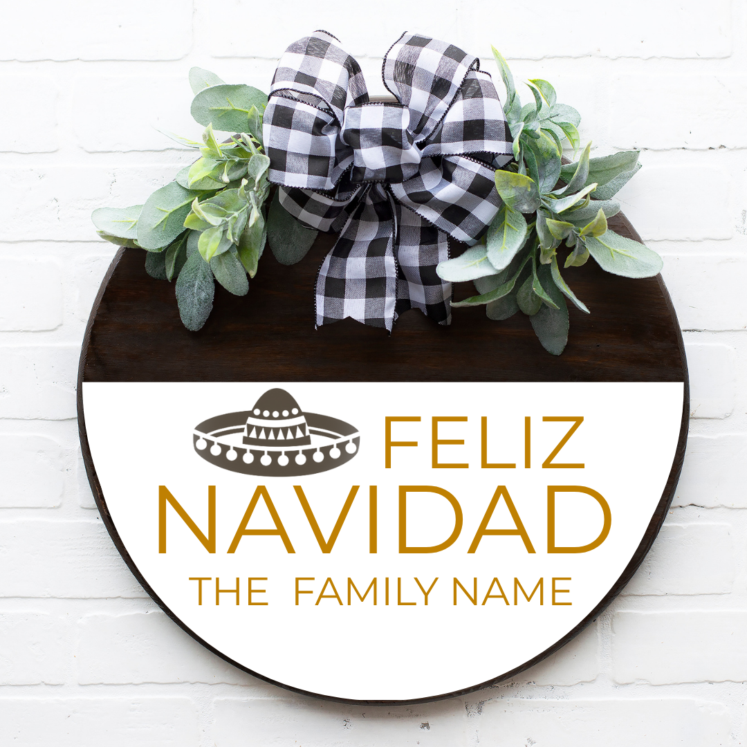 Feliz Navidad round door personalized with family name in gold font. Comes with a plaid bow and greenery