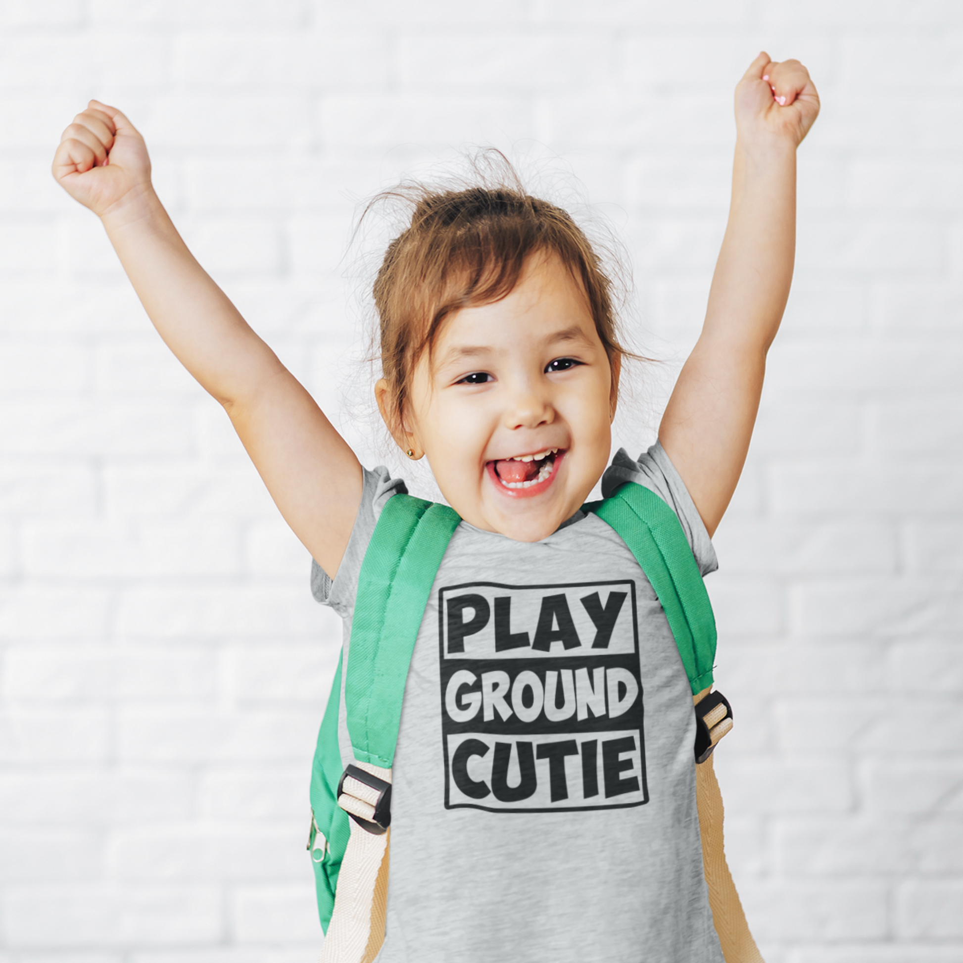 Girl wearing Playground Cutie tee for outdoor play and school