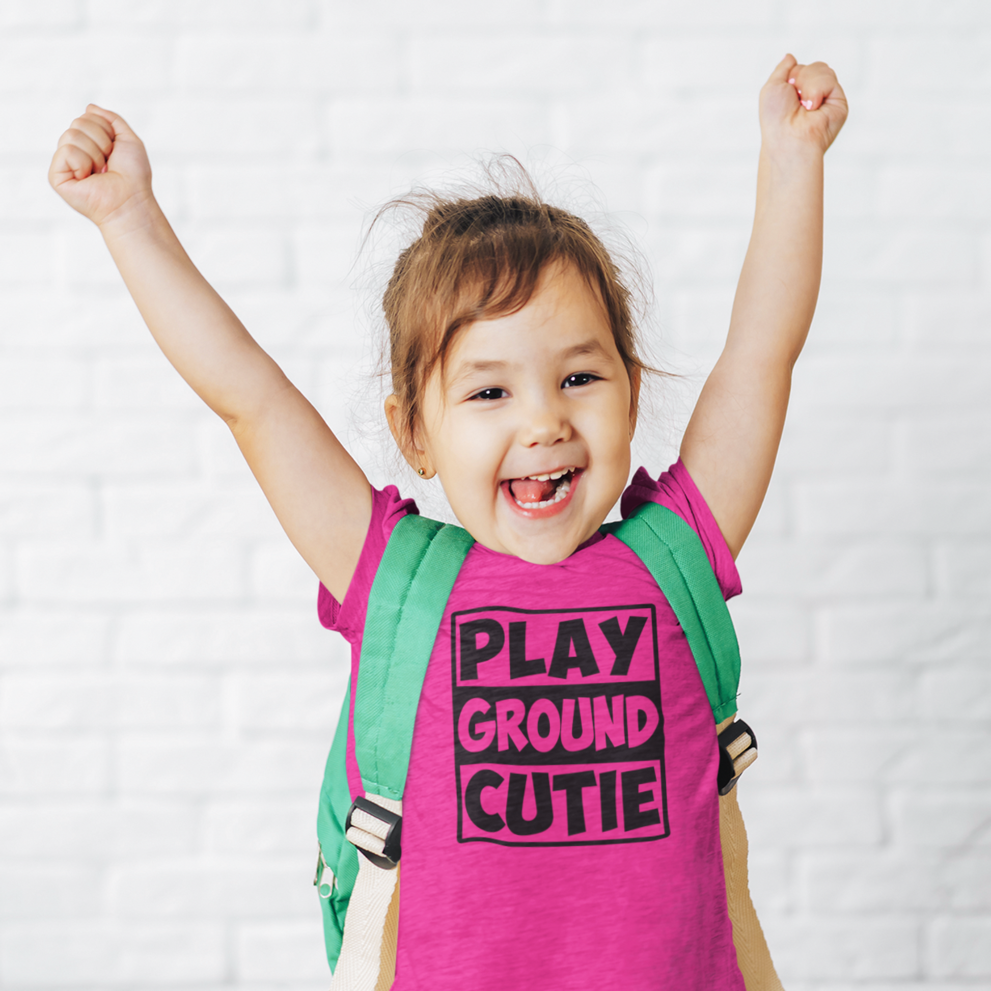 Girl wearing Playground Cutie tee for outdoor play and school