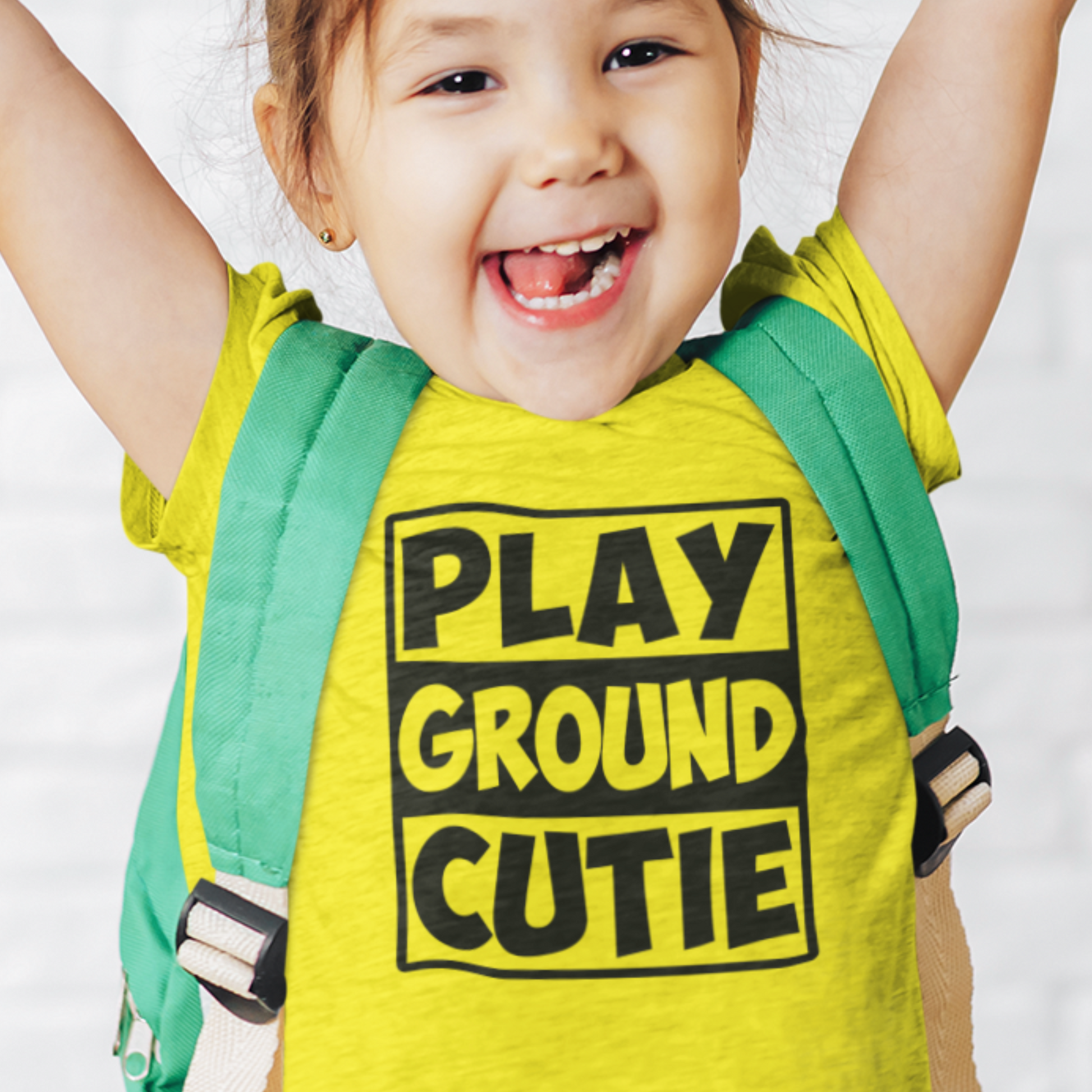 Girl wearing Playground Cutie tee for outdoor play and school