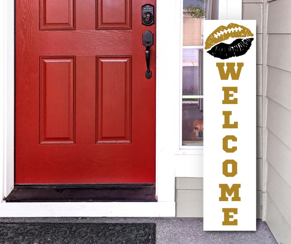 Handcrafted 4ft vertical football sign in black, and gold colors. Features a lip-themed welcome message. Custom Game Day Decor by Simply Aloha On The Go.