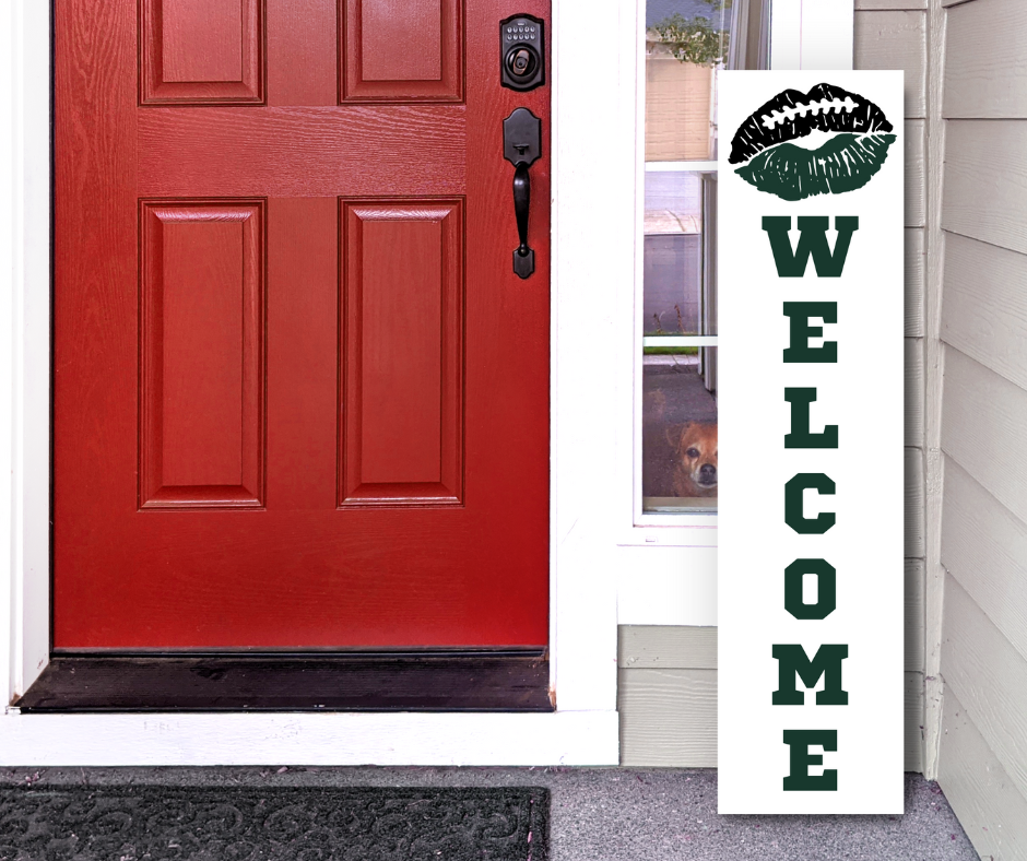 Handcrafted 4ft vertical football sign in black, and midnight green colors. Features a lip-themed welcome message. Custom Game Day Decor by Simply Aloha On The Go.