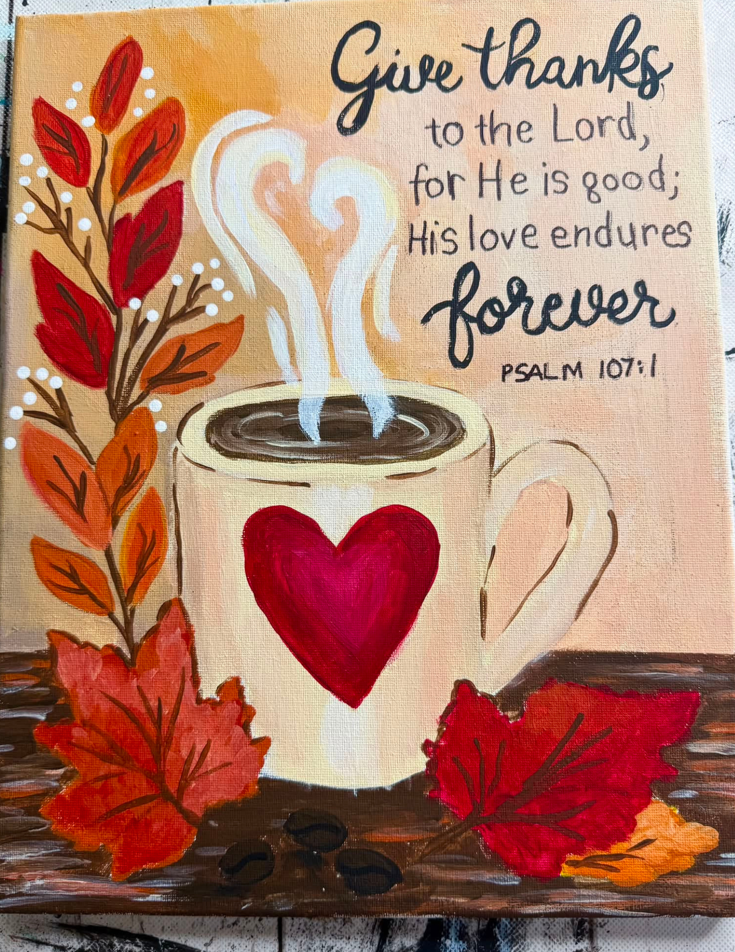 Colorful Give Thanks fall painting with a coffee mug, autumn leaves, heart, coffee beans, and Psalm 107:1