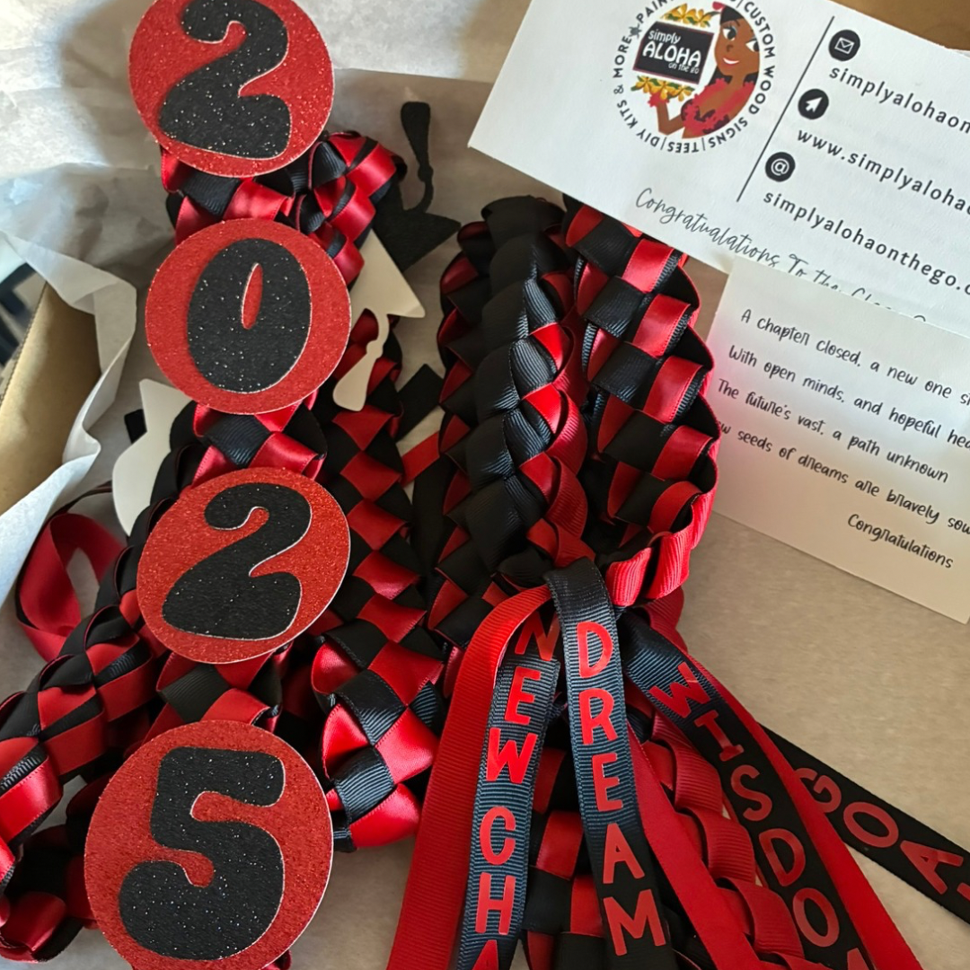Close-up of a 2026 personalized  Graduation Ribbon Lei in red and black with graduate’s name and grad yr