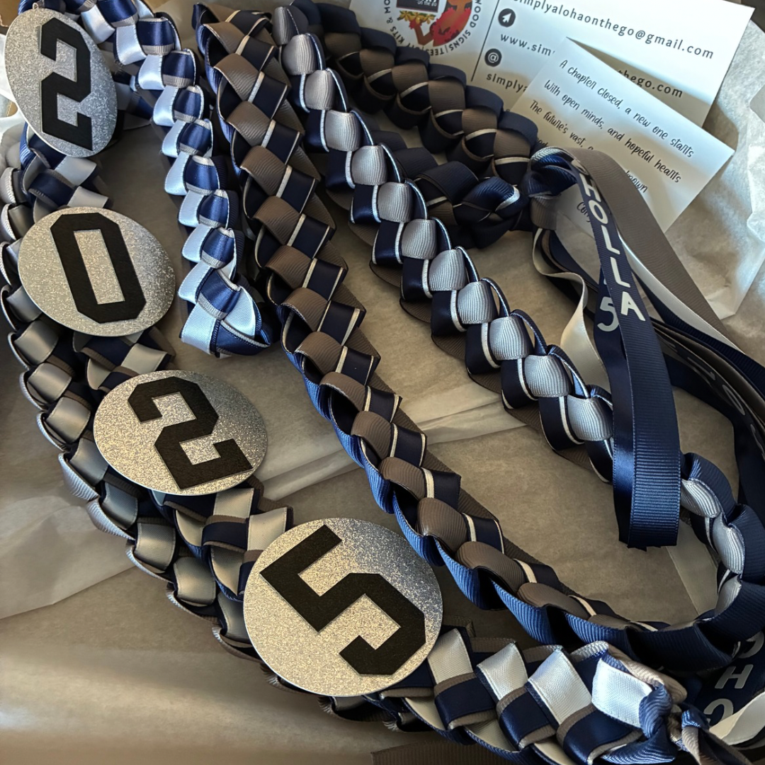 Close-up of a 2026 personalized Graduation Lei in three school colors,  graduate’s name and yr