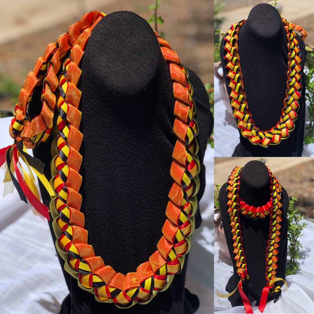 Custom graduation ribbon lei collage featuring orange, black, red and gold braided ribbon designs displayed on black stands.