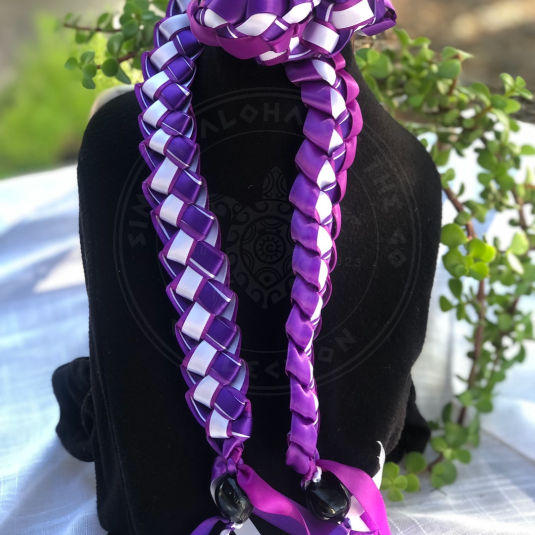 Personalized Graduation Ribbon Lei in purple and white with an open-ended braided design and decorative ribbon tassels.