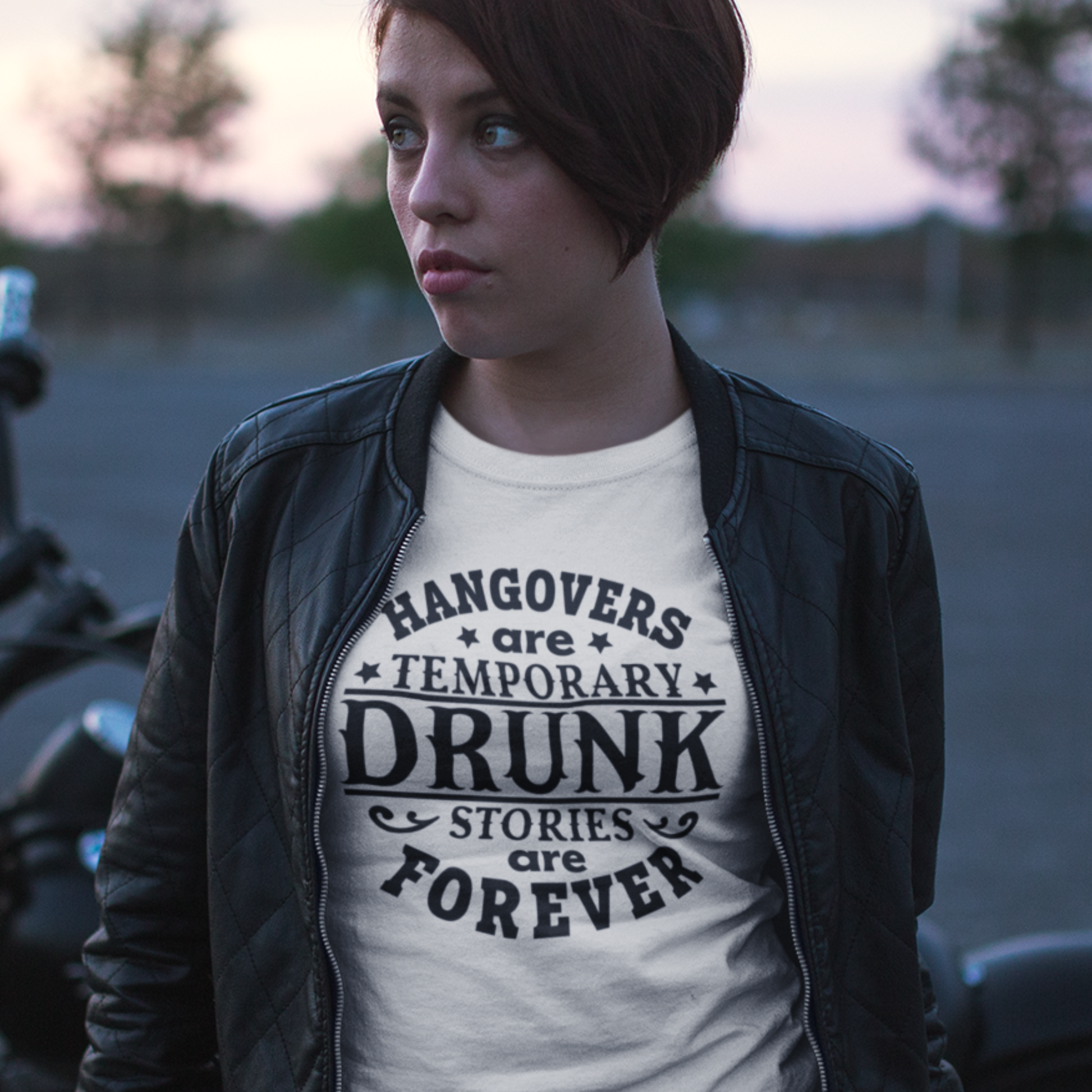 A woman wearing a  Hangover Recovery T-Shirt In white. Funny Graphic Tee for Morning After. Available in many sizes and colors.