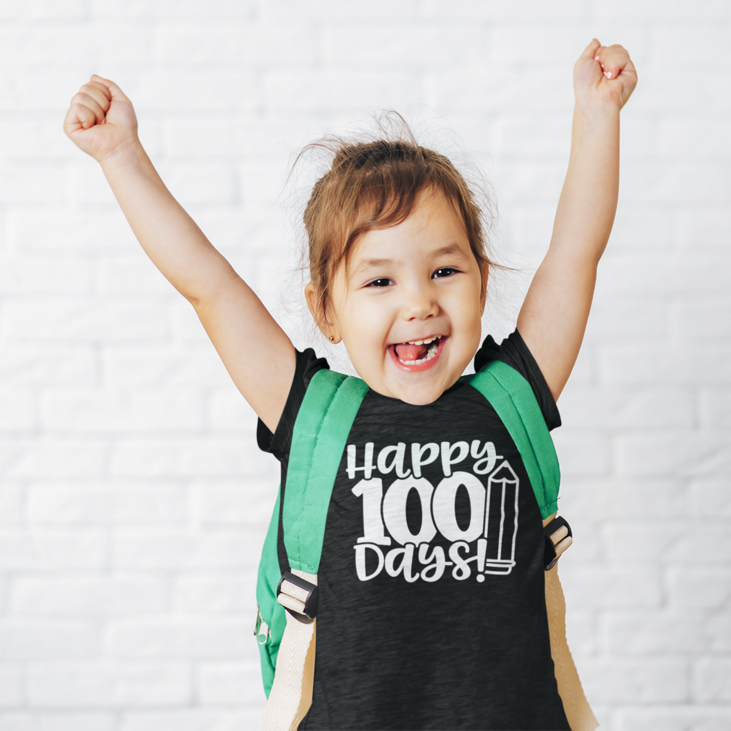 Smiling girl wearing purple Happy 100 Days kids t-shirt with backpack