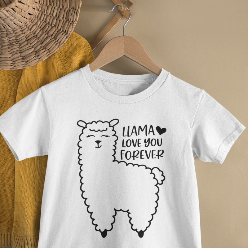 White t-shirt with a black llama graphic and text that reads llama love you foerver on a wooden hanger against a beige wall.