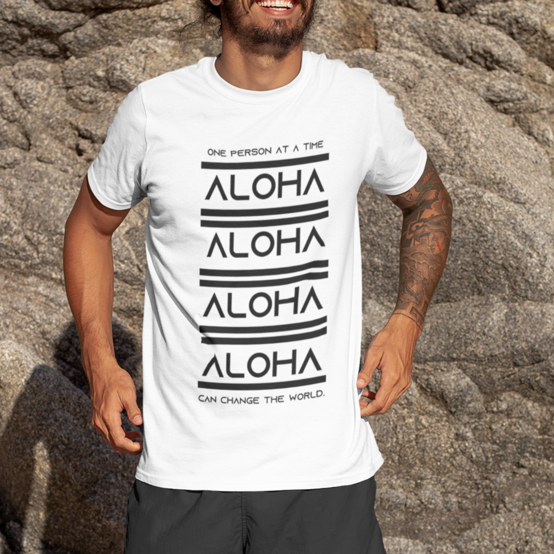 Aloha T-shirt featuring the inspirational message One Person At A Time Can Change The World. This shirt represents the Aloha spirit a perfect reminder of how small actions can make a big difference.