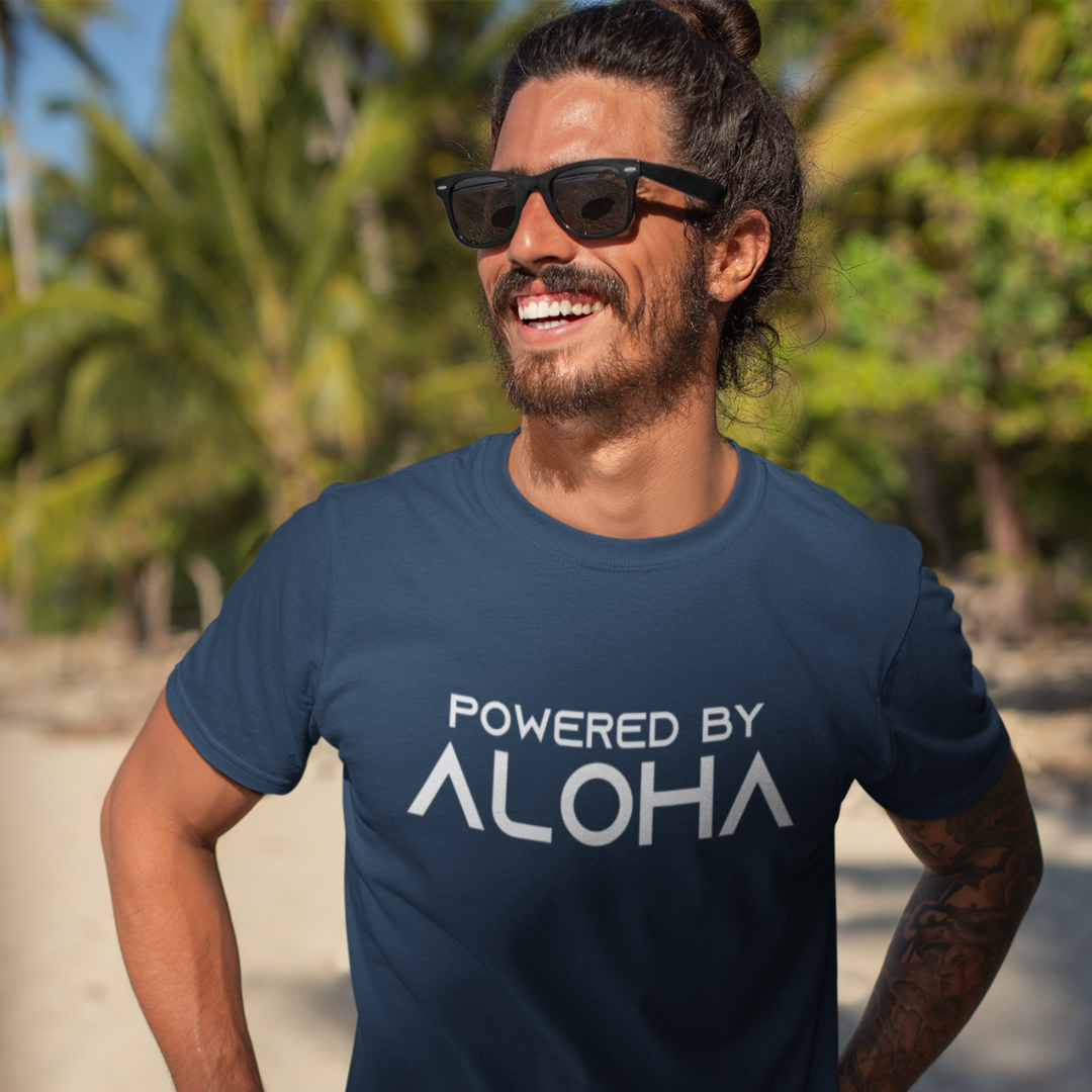 POWERED BY ALOHA Men’s T-Shirt in navy blue with a vibrant Hawaiian text design, island style inspirational tee.