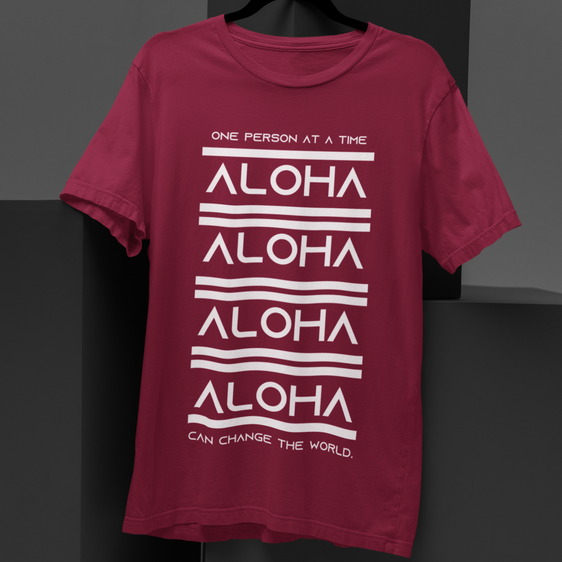 Aloha T-shirt featuring the inspirational message One Person At A Time Can Change The World. This shirt represents the Aloha spirit a perfect reminder of how small actions can make a big difference.