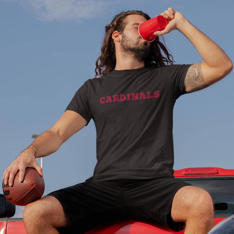 A man at a tailgate wearing a Men’s NFL Game Day T-Shirt printed horizontally with team's name – handcrafted with aloha, ARIZONA CARDINALS fan – Simply Aloha On The Go