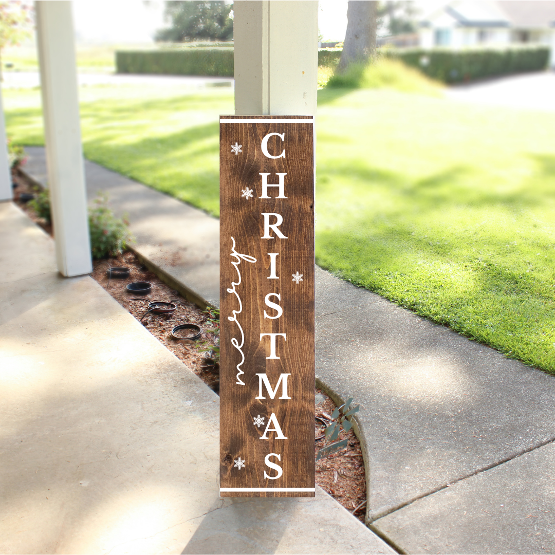 Merry Christmas vertical porch sign with stained wood finish and multilingual greeting, handcrafted holiday leaner by Simply Aloha On The Go
