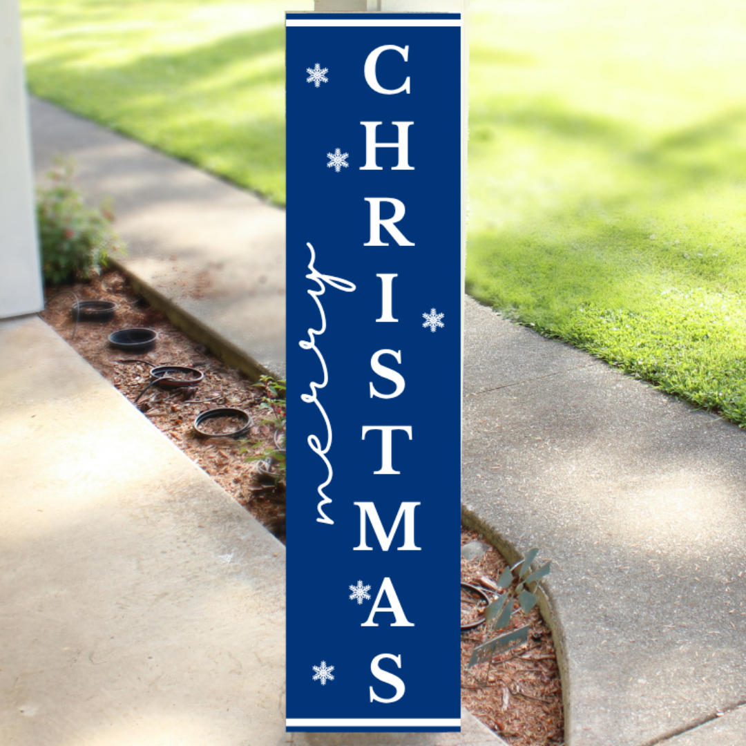 Vertical blue wood Christmas porch sign readingMerry Christmas with white lettering and snowflake accents, handcrafted by Simply Aloha On The Go