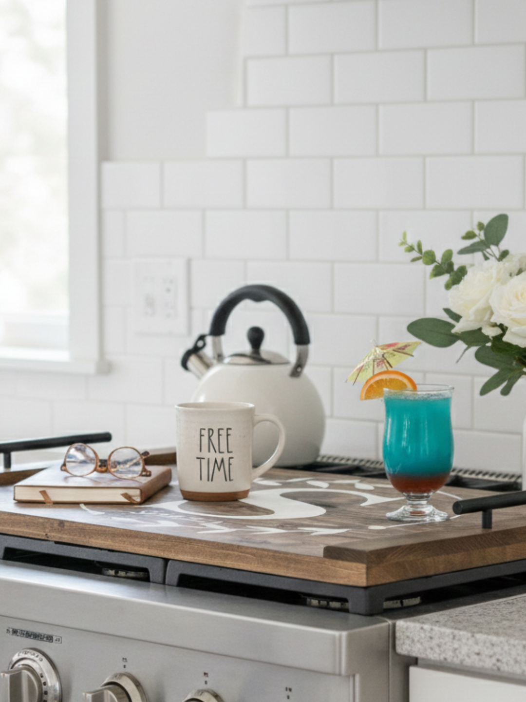 Monogram Wreath Noodle Board Stove Top Cover styled on a kitchen stovetop