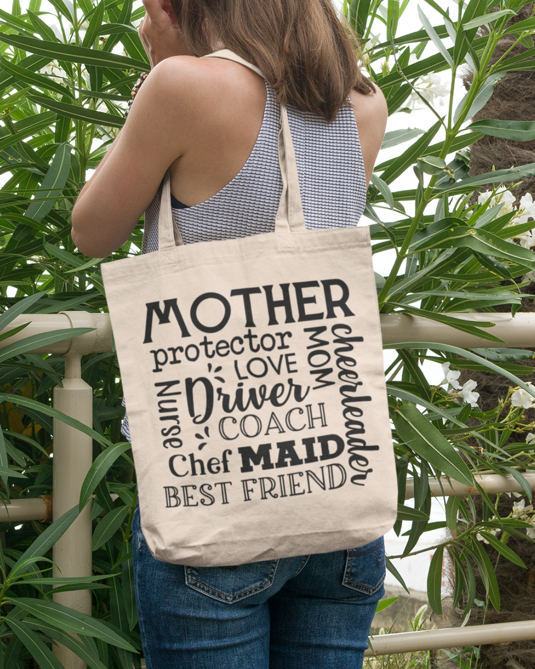 Mom's canvas tote bag featuring text Mother Protector Love  Cheerleader and more 