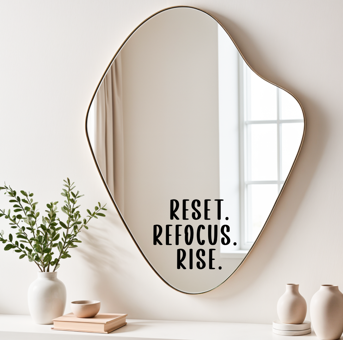 Motivational mirror decal with Reset Refocus Rise affirmation in black vinyl lettering on decorative mirror