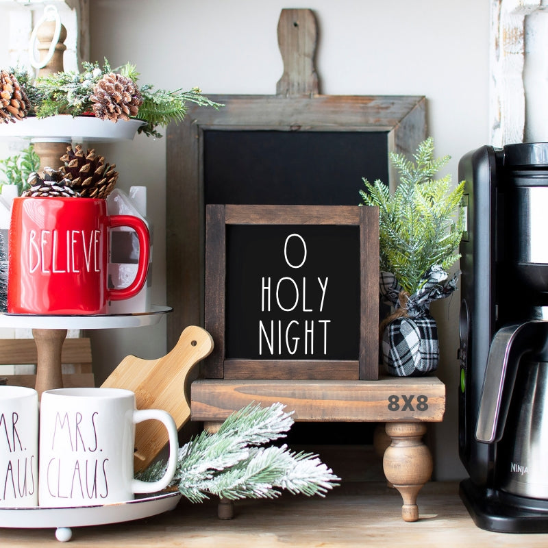 Black O Holy Night Christmas tiered tray sign with white lettering and rustic wood frame displayed with holiday decor.