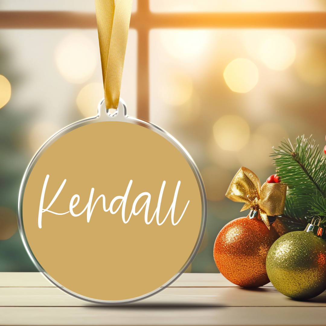 Personalized 3-inch clear acrylic with your name in cursive font-ornament with permanent white vinyl lettering with a satin ribbon and gold background