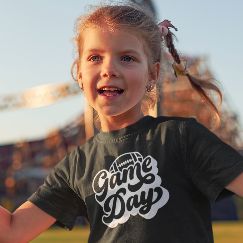 Personalized Kids Girls Black Double-Sided T-Shirt featuring a football graphic and game day text on the front and a player number on the back, from Simply Aloha On The Go.