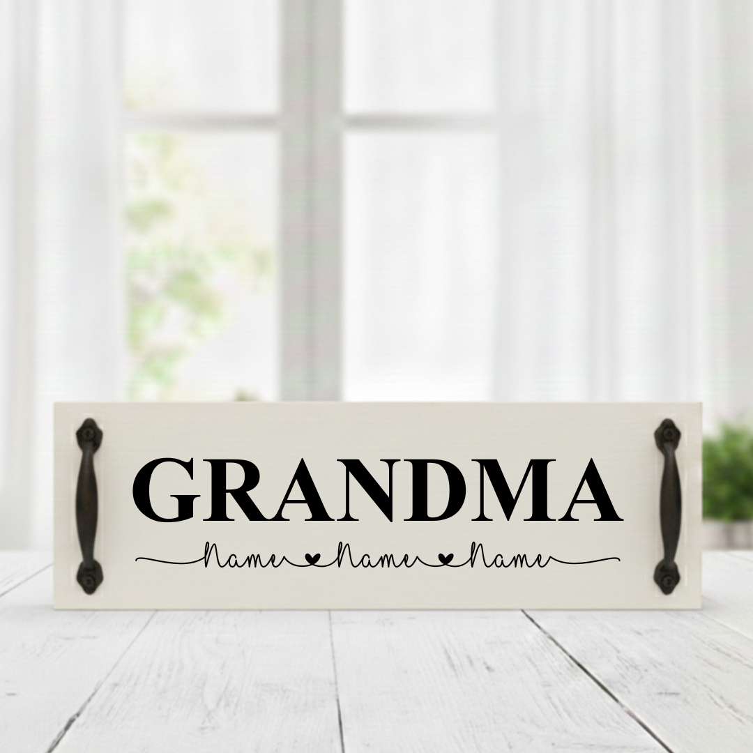Handcrafted Mother’s Day white background wood sign featuring GRANDMA in bold black text with custom black handles and personalized children's names.