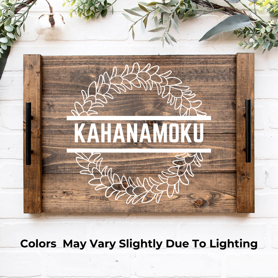 A rustic farmhouse noodle board in stained background, white design color with a beautiful plumeria flower design and a personalized family name, made and designed by Simply Aloha On The Go