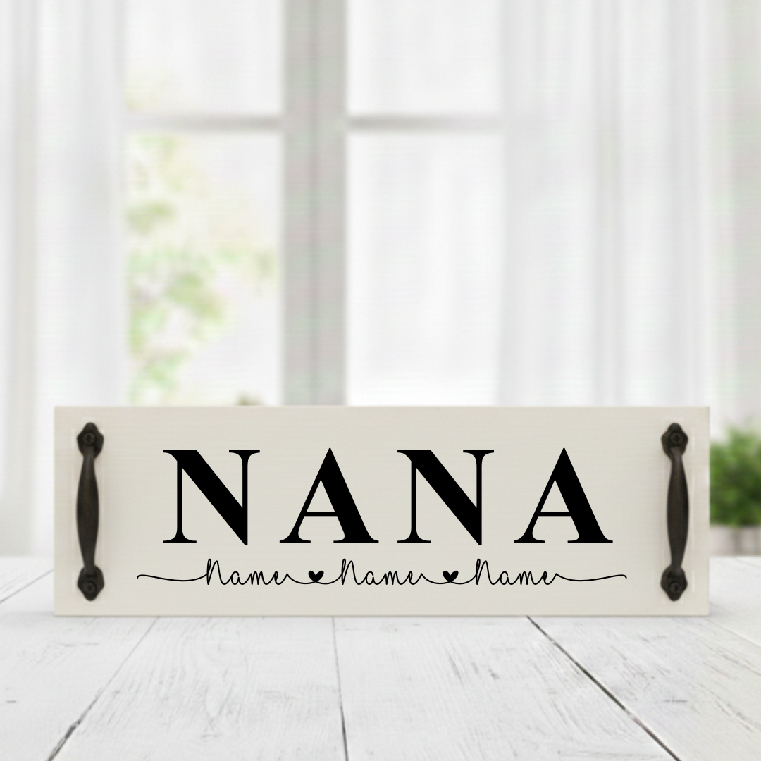 Handcrafted white background wood sign featuring NANA in bold black text with custom black handles and personalized children's names.